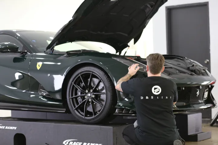 Installer fitting film to a Ferrari
