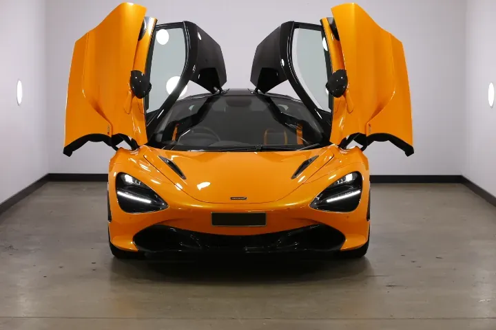 Orange McLaren with dihedral doors open